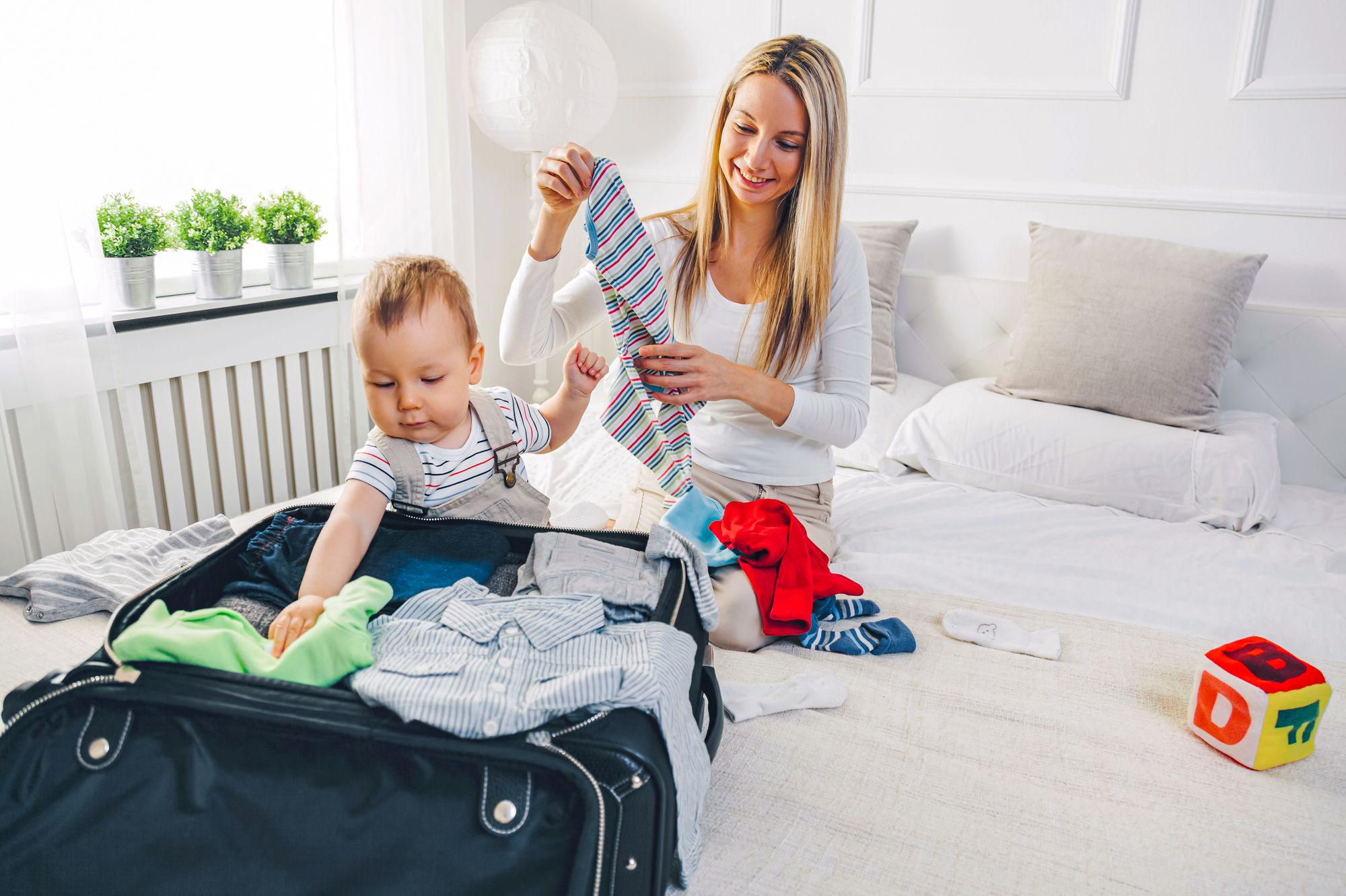 Mom Unpacking Travel Suitcase