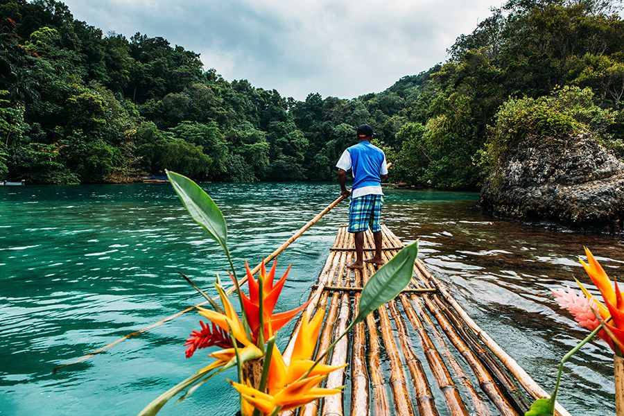 Photo of man rowing a boat on the beaches of Jamaica