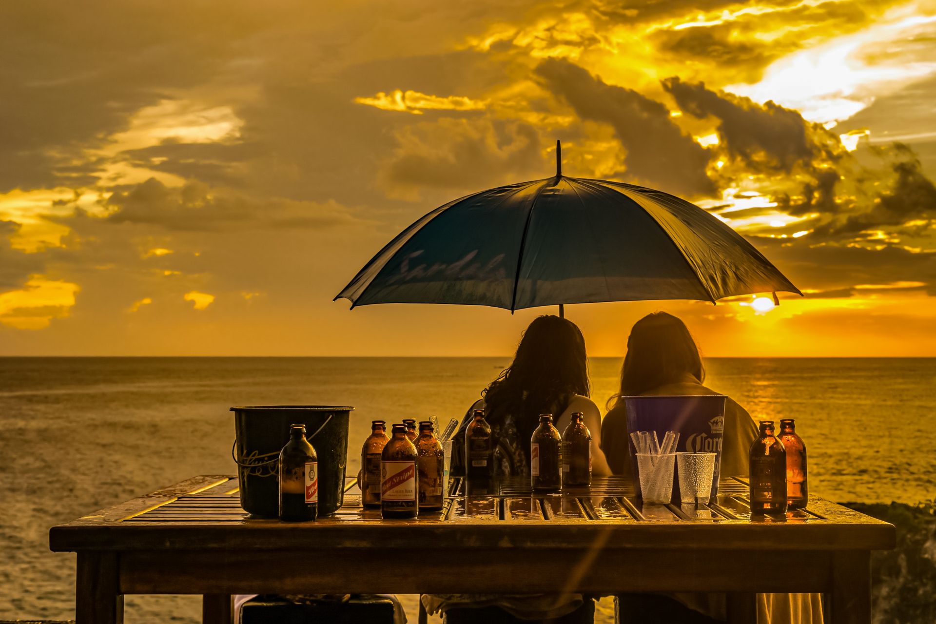 Couple watching sunset Ricks Cafe Negril